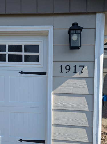 a house with a white door and a black door