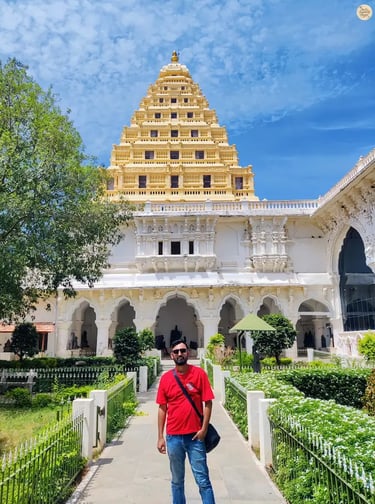 Visitor posing in front of the historic arsenal at Thanjavur Palace, Tamil Nadu