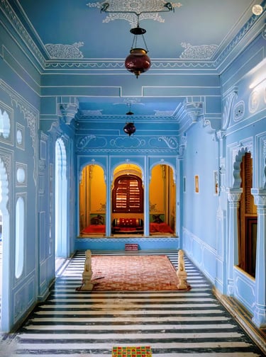 Interior of Bhim Vilas showcasing stunning aesthetic and soft blue walls, City Palace Udaipur India.