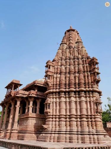 Intricate outer wall carvings of a temple in Mandore Garden Jodhpur, a glimpse into Rajasthan’s historic temple architecture.