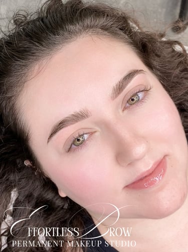 A view of symmetrical and softly defined ombre powder brows immediately after the service.