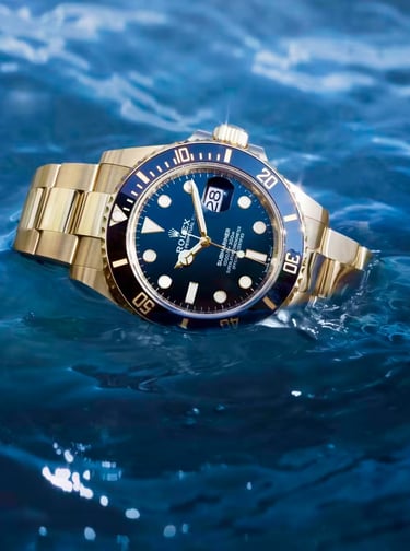 Gold Rolex Submariner luxury dive watch floating on water, showcasing its waterproof design.