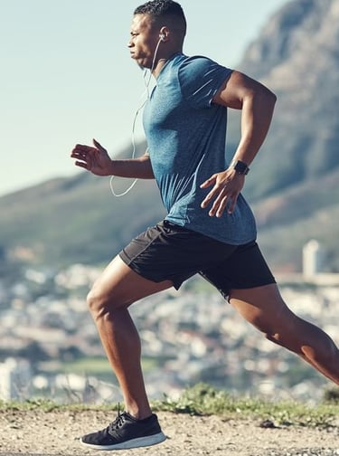 a man running on a mountain trail