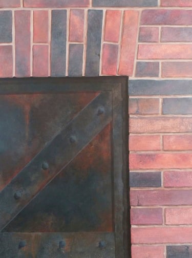 Décor peint en trompe-l'oeil, une porte rivetée en métal rouillé avec un mur en briques