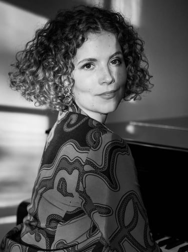 a woman iportrait and a piano