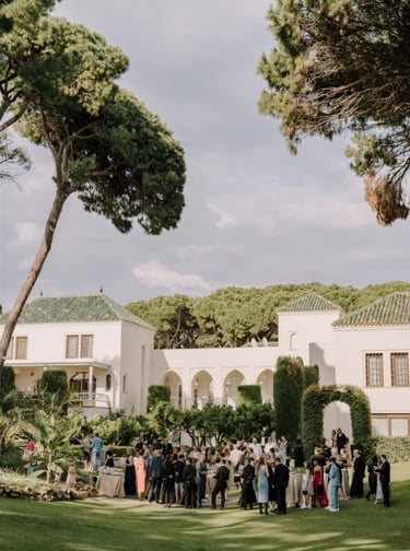 Garden event at Villa El Rincon with guests gathered among lush greenery