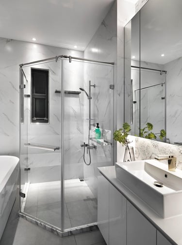 Modern bathroom with glass shower and white vanity – shows the tidy result after a leak repair in an