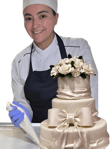 Natalia smiling while holding a beautifully decorated cake, showcasing her artisanal baking skills.