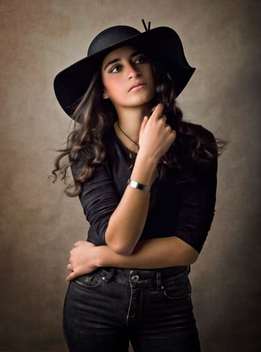 a Fine art children portrait photography of a girl wearing a black hat in a Western Sydney studio