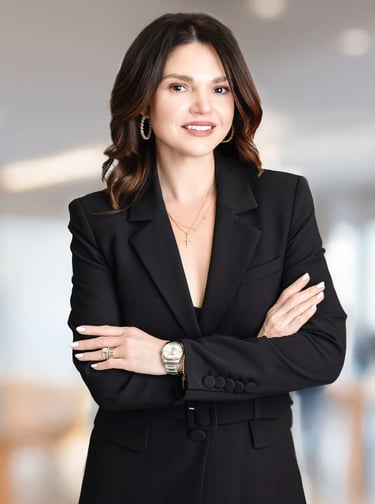 a woman in a black suit and a watch