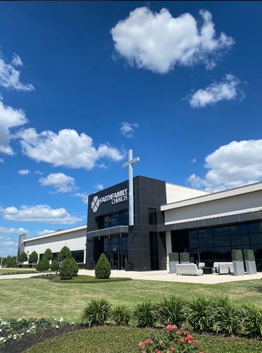 A photo of a church with a cross on top of the roof located in Baytown, Texas