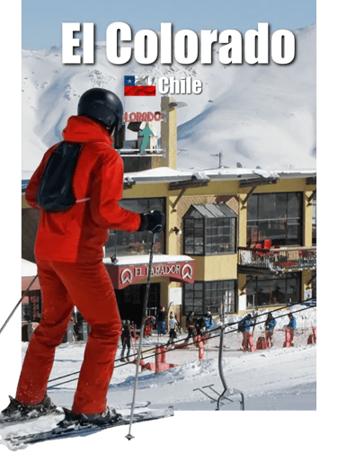 Skier in red suit descending a snowy slope at El Colorado Ski Resort, Chile, with a view the base