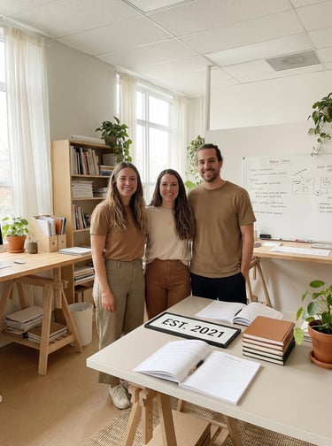 a man and woman standing in a room with a whiteboard