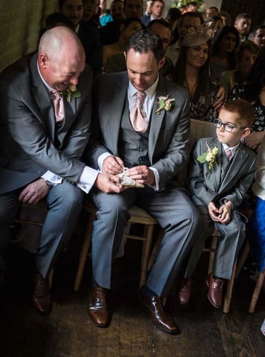 best man trying to find the wedding rings at the ceremony