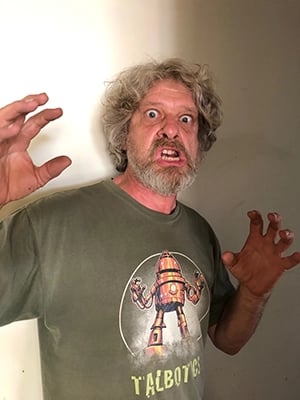 Talbotics t-shirt wearer recreating robot pose.