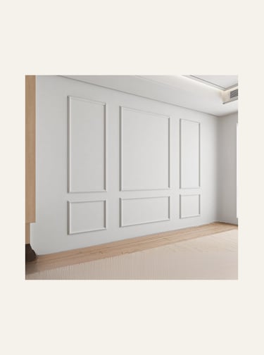 Elegant white wall with classic decorative picture frame wall molding and wainscoting panels.