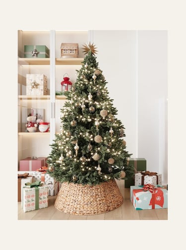 ELYKEN 28-Inch Woven Rattan Christmas Tree Collar, shown on a decorated tree