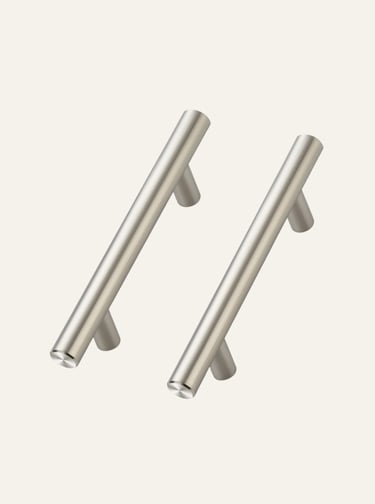 Two modern brushed nickel cabinet pulls with a sleek T-bar design for kitchen drawers.