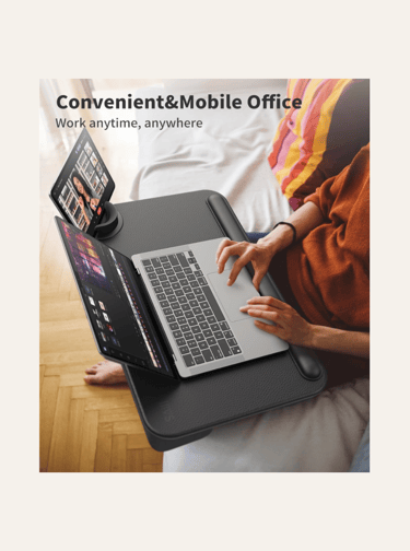 picture of a woman's lap with a black lap desk a n open laptop and tablet on the side
