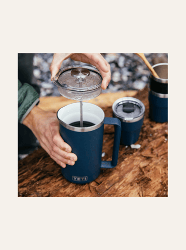 picture of a navy blue yeti french press with coffee inside