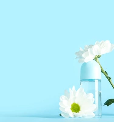 a bottle of water with a flower in it