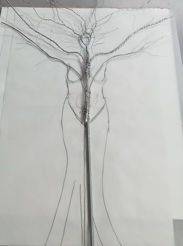 Structure de Karya en fil d'aluminium posée sur le croquis de la sculpture