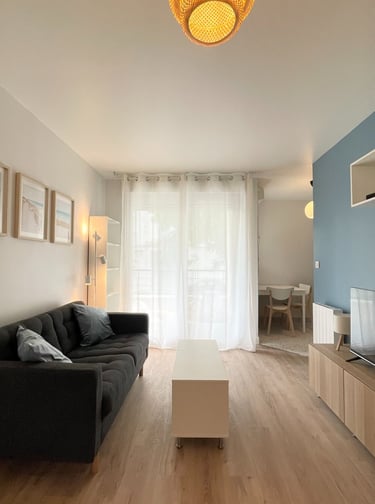 a living room with a couch and a television