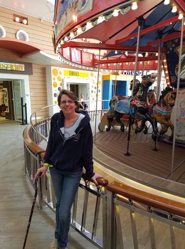 Lady Michelle pauses by the Merry-Go-Round on Harmony of The Seas