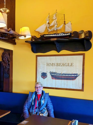 Lady loves the HMS Beagle in Taberna Del Viejo Lobo in Ushuaia, Argentina 