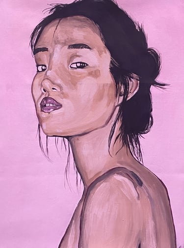 portrait of a woman of asian descent with a pink background