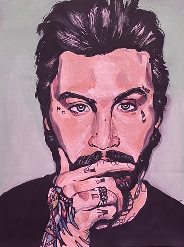 portrait of a white man with his hand by his face