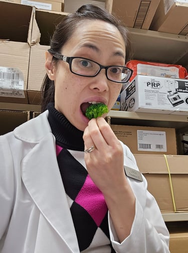 Pharmacist Linda eating broccoli