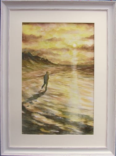 Lone figure, lost in thought, walks across Southport sands with setting sun reflected in the waves