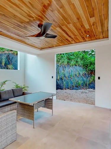 a living room with a ceiling fan and a ceiling fan