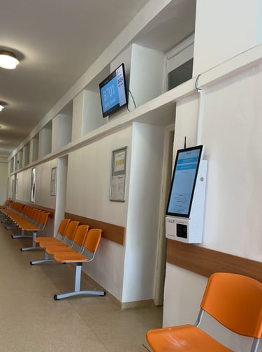 a long row of chairs in a hospital
