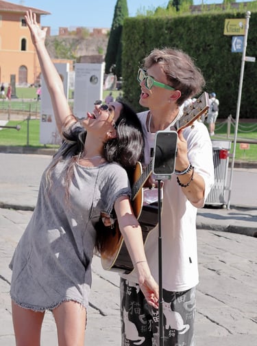 a man and woman standing in front of a parking meter