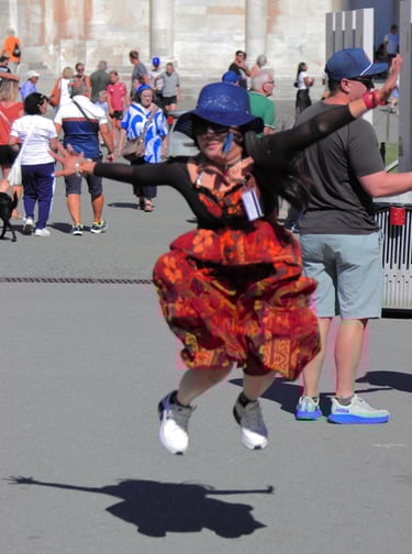 a woman in a red dress and a man in a blue hat