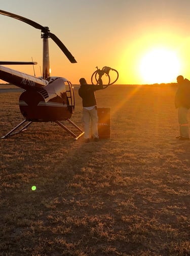 refueling the helicopter in a setting sun