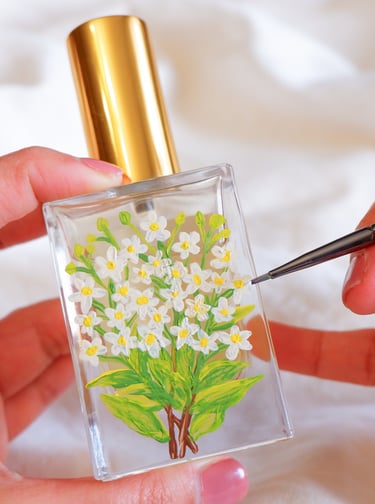 Perfume bottle personalized with floral painting by NYC live event artist Handwritten by Belle.
