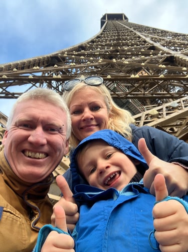 Family at the base of the Eiffel Tower