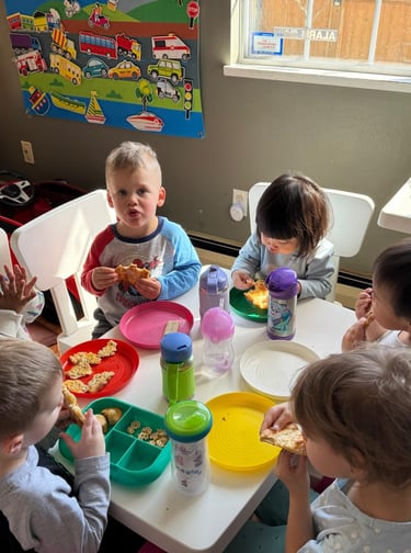 Mixed Aged Toddlers Having Their Food Together
