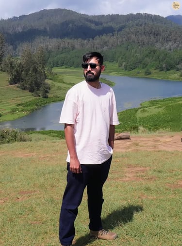 Traveler at Mannavanur Sheep Farm with heart-shaped Mannavanur Lake in the background.