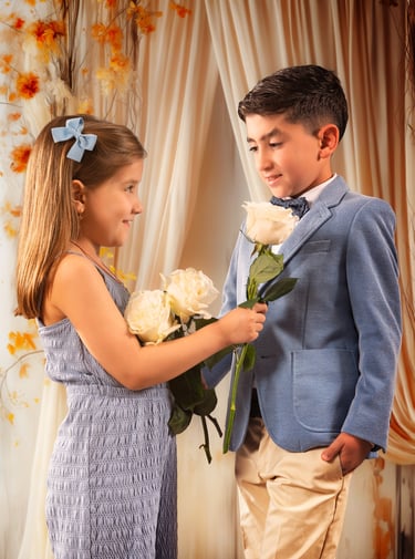 a boy and girl in a blue dress