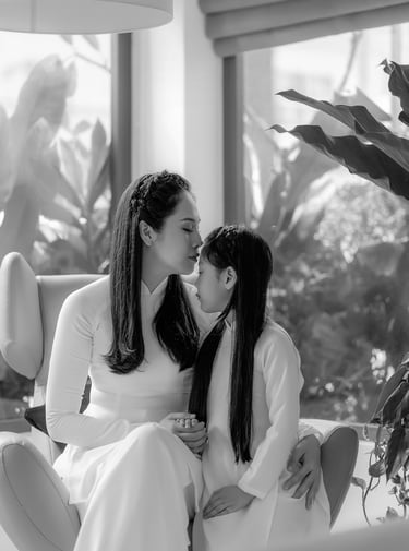 a mother and daughter kissing in a living room