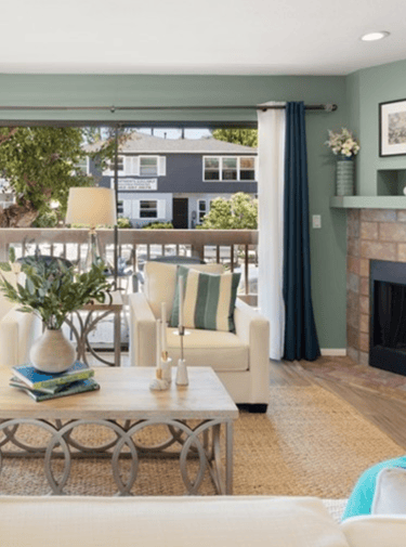 A staged living with luxurious furniture and accessories