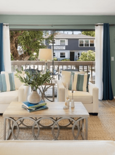 A staged living with luxurious furniture and accessories