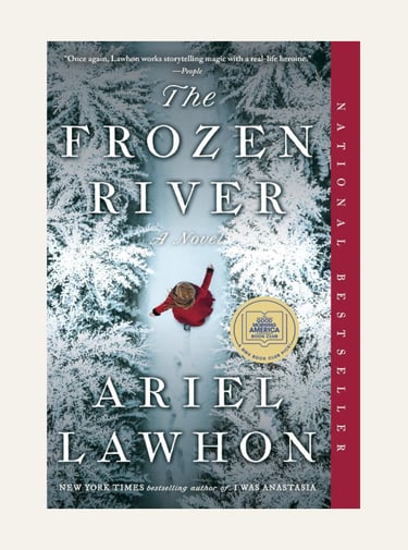 Book cover for The Frozen River by Ariel Lawhon featuring a woman walking through a snowy forest path.