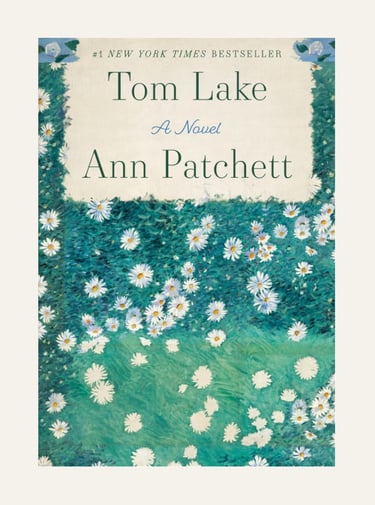 Book cover for Tom Lake by Ann Patchett featuring white daisies on a green field.