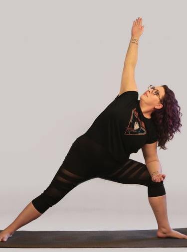 rachel in yoga pose, black outfit purple hair white background
