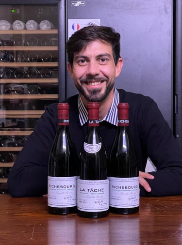 a man in a sweater and sweater with a wine bottle